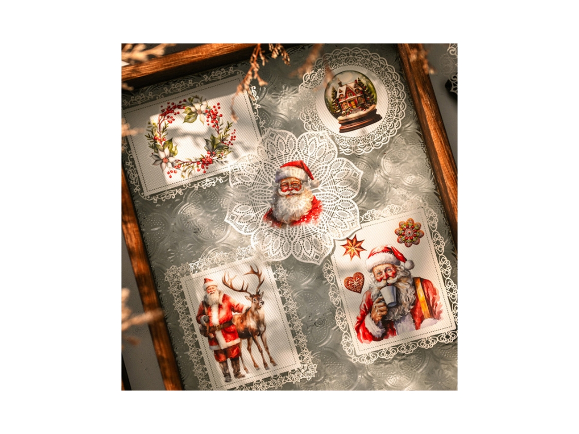 Juego de pegatinas retro Rubo con temática navideña, diseños de Papá Noel y copos de nieve MDUG