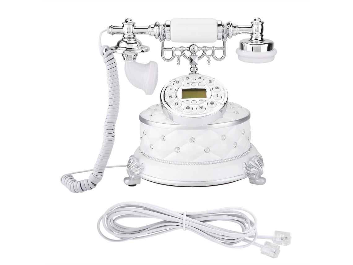 Teléfono antiguo retro con piedra preciosa blanca de imitación
