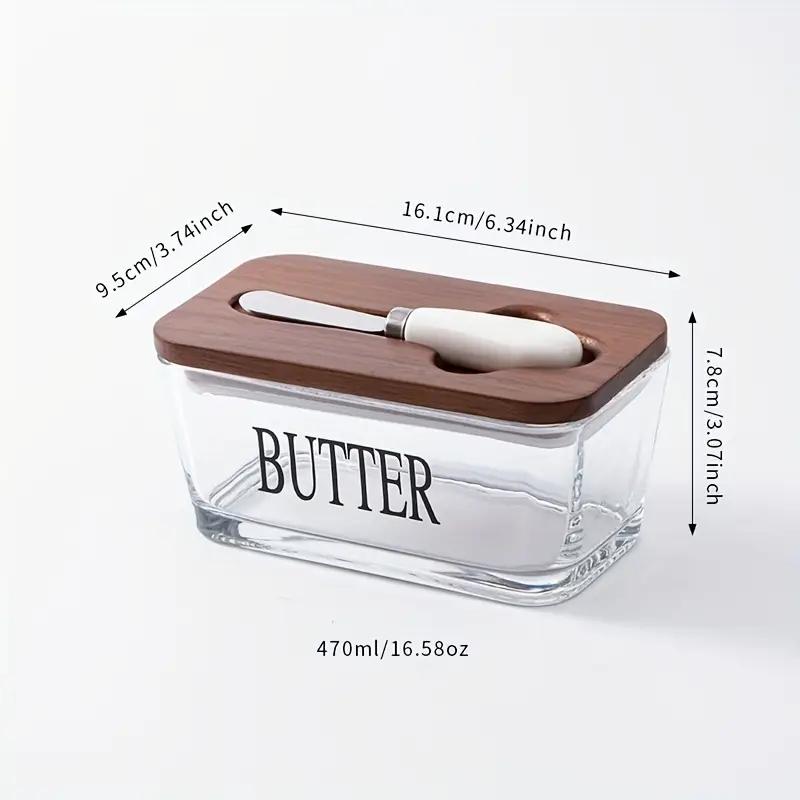 Mantequera de vidrio con tapa de roble y cuchillo para mantequilla, ideal para conservar la mantequilla fresca y dorada.
