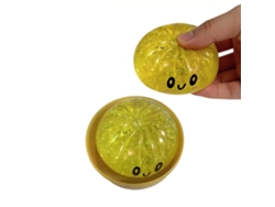 Juguete blando con cinta dorada y diamantes de imitación amarillos.