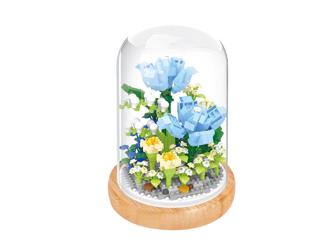 Kit de bloques de construcción de flores azules en miniatura con cubierta protectora.