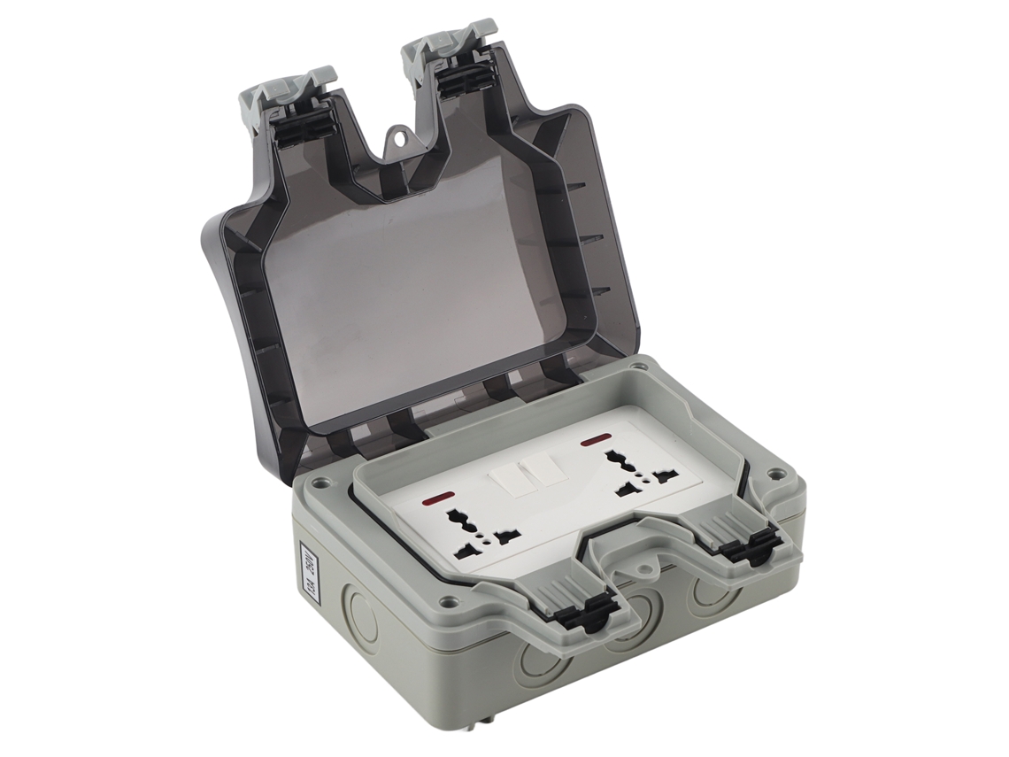 Enchufe Exterior Impermeable Con 2 Tomas De 3 Orificios Y 2 Interruptores.