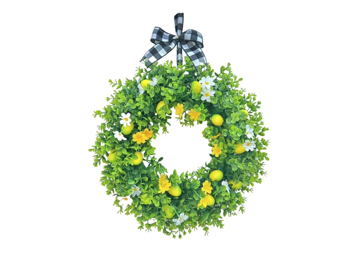 Corona de limones artificiales para decorar la puerta en verano.