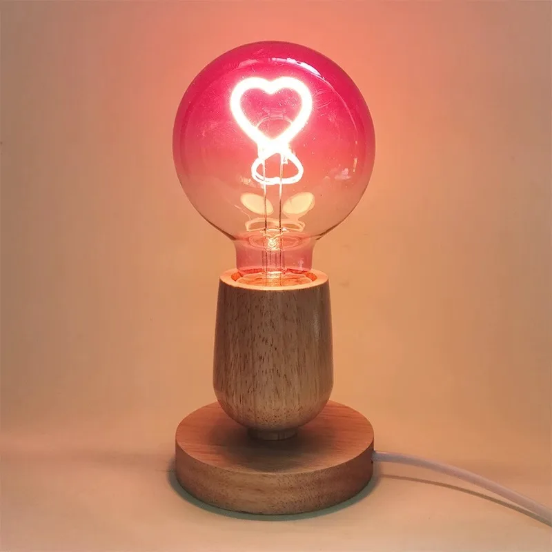 Bombilla LED de filamento en degradado rosa para iluminación ambiental romántica, casquillo E27 en forma de corazón, regulable.