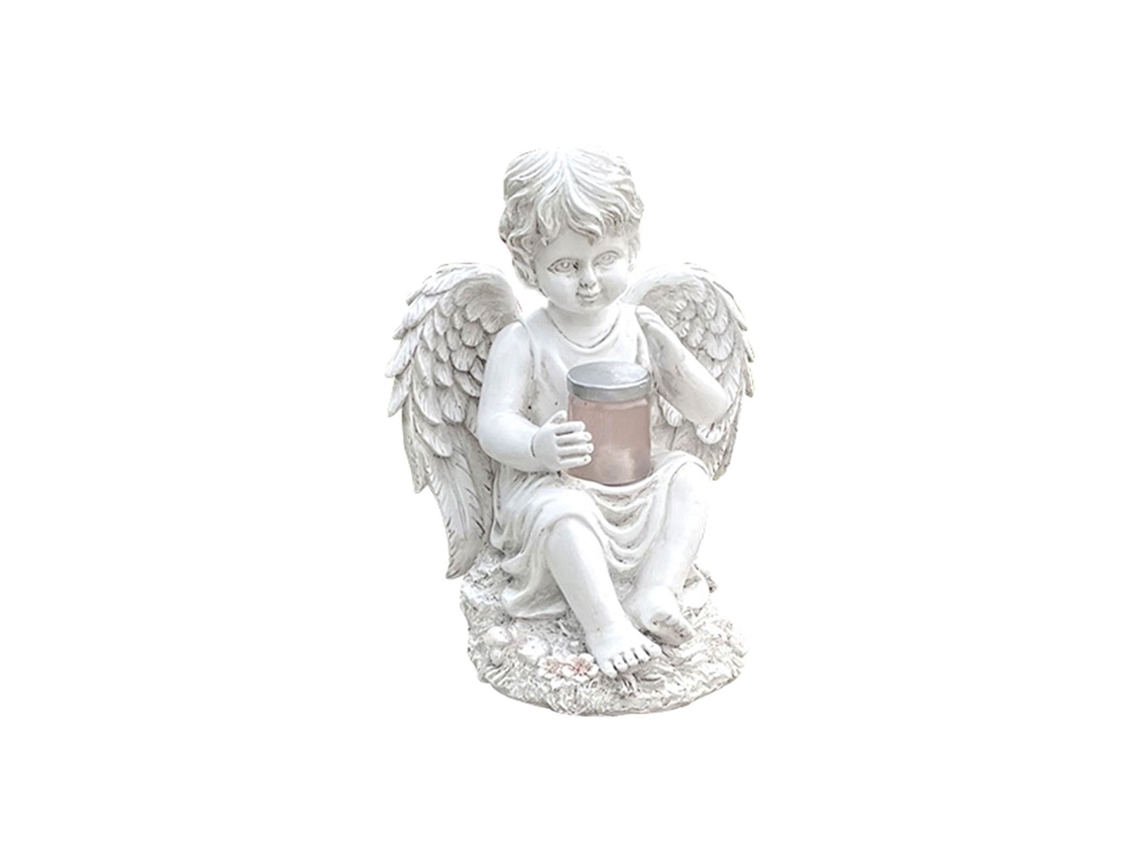 El Jardín Está Decorado Con Luces Solares Y Cuenta Con Una Estatua De Un Ángel.
