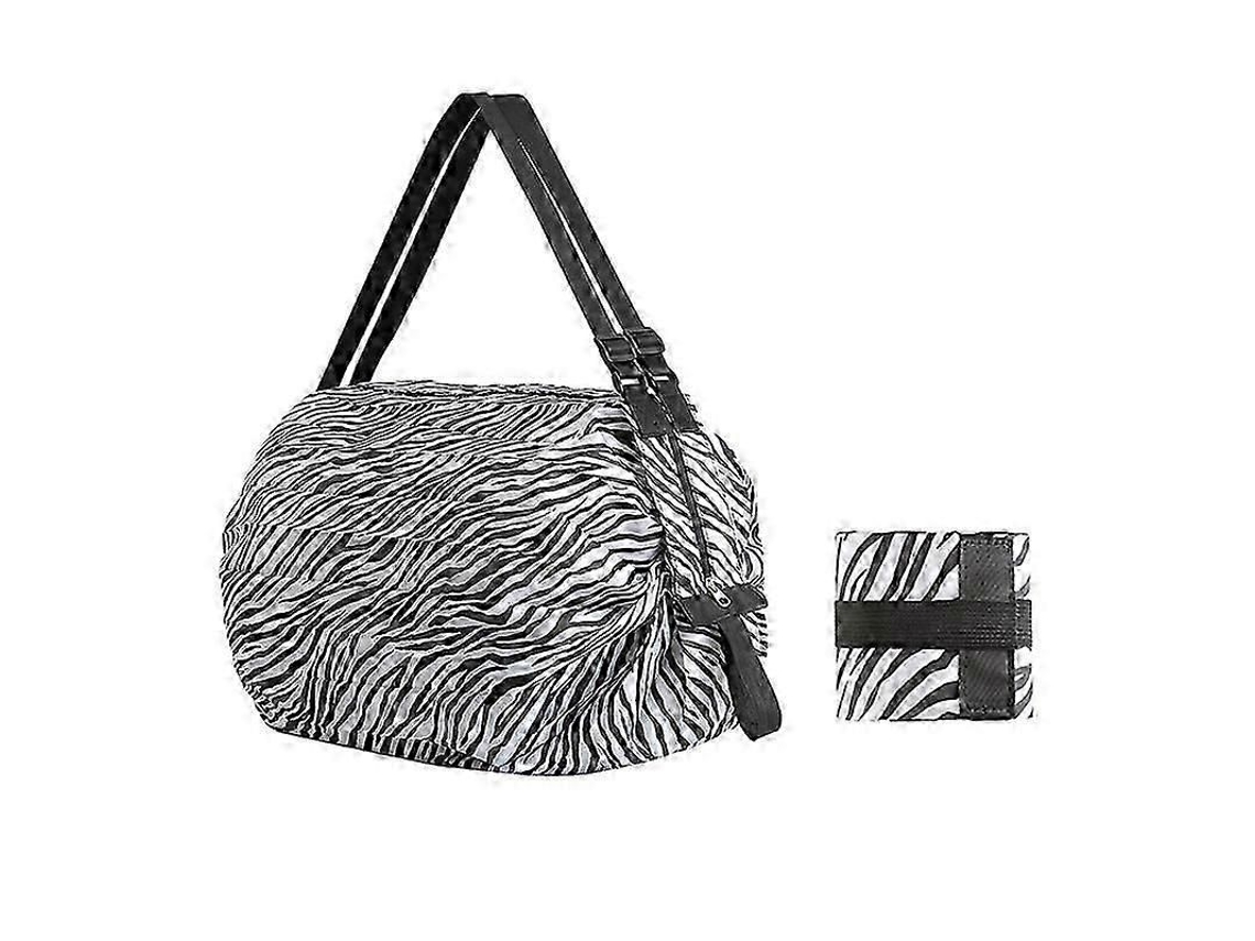 Bolso de playa con compartimentos ligeros para la compra, funda de transporte plegable de nailon en color negro.