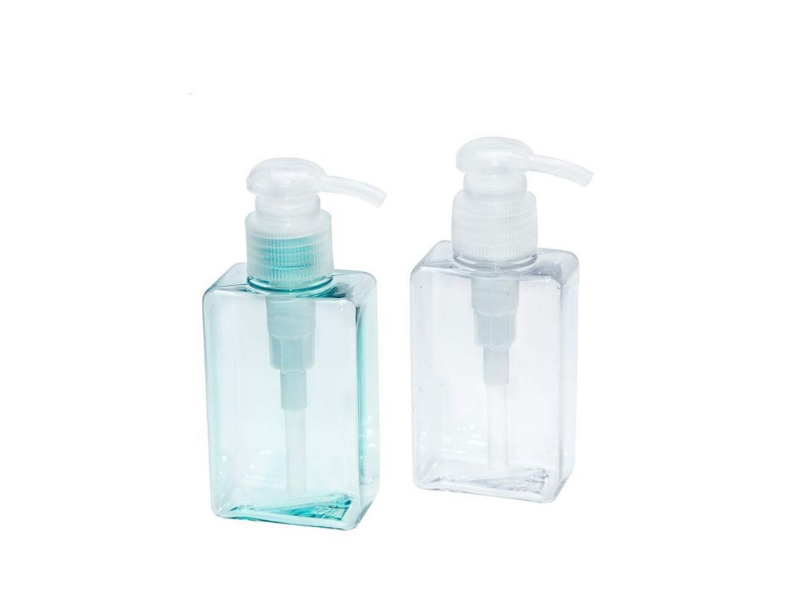 Botellas de plástico azul y transparente de 100 ml con dosificador para champú y gel de ducha reutilizable.