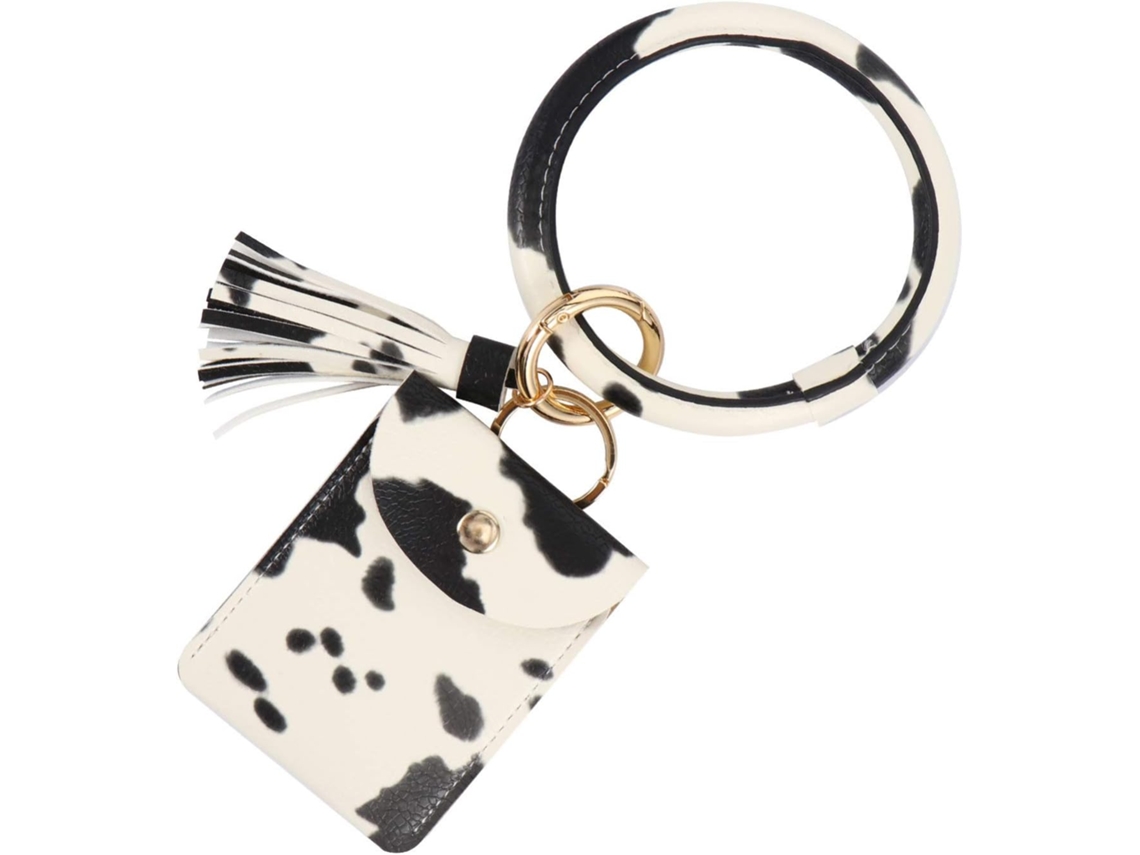 Llavero con forma de vaca y bolsillo: mini organizador para monedas y llaves.