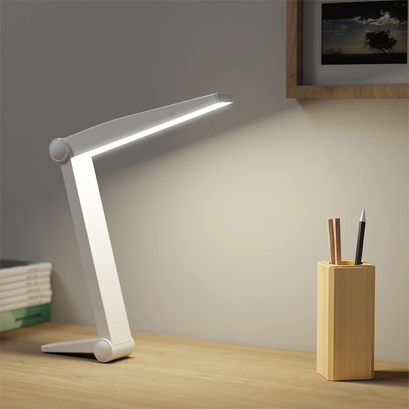 Lámpara de escritorio LED plegable (blanca) para lectura, protección ocular, con intensidad de luz ajustable.