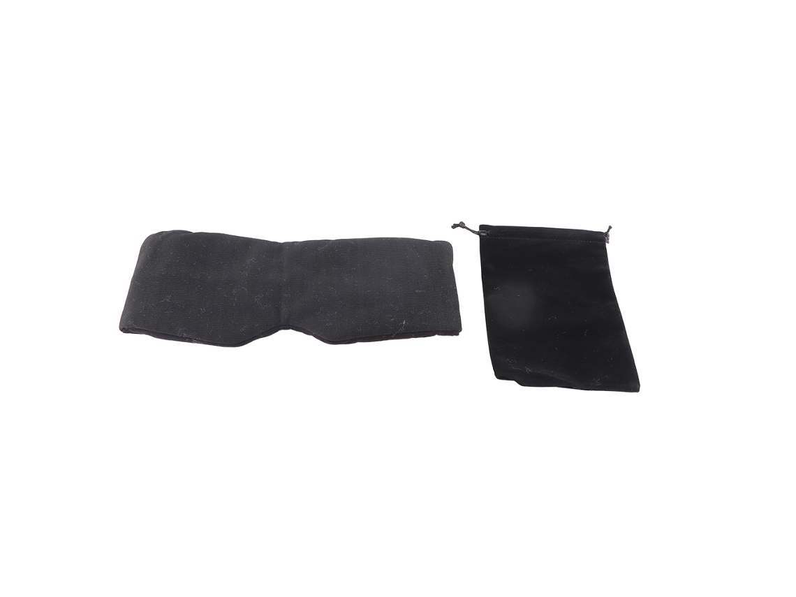 Antifaz para dormir de algodón negro, cómodo y ajustable para viajes con bolsa incluida.