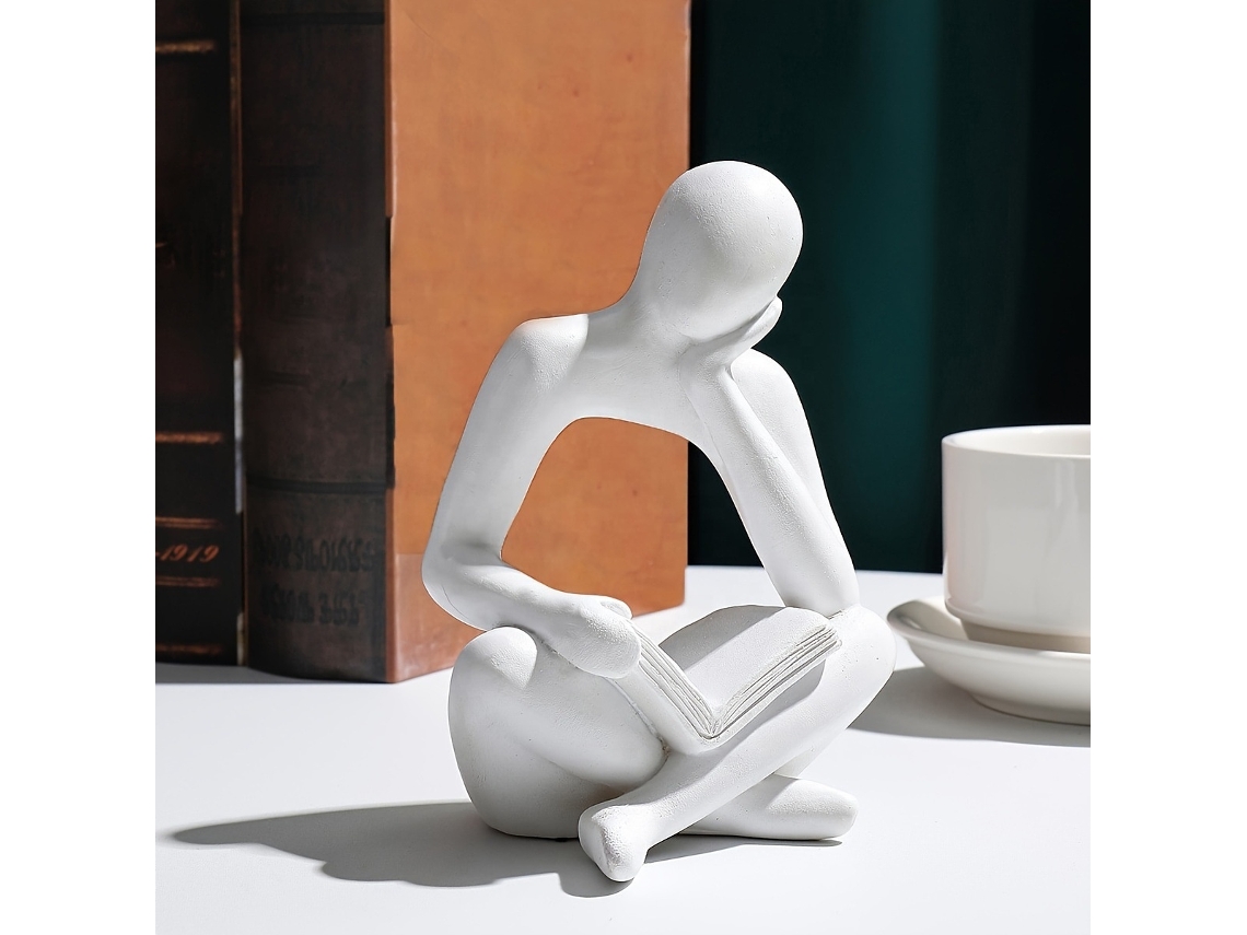 Artesanías abstractas de resina, pequeñas estatuas, lectura de libros sentado