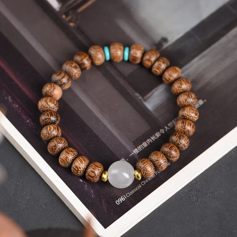 Pulsera amuleto hecha a mano con cuentas de ábaco, elaborada en madera de palisandro natural. MDUG