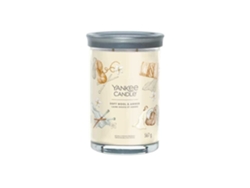 Vela Yankee Candle Signature en vaso grande, color ámbar suave.