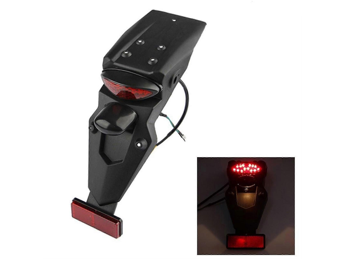 Cubierta trasera negra para motocross con luz de freno y portamatrículas.