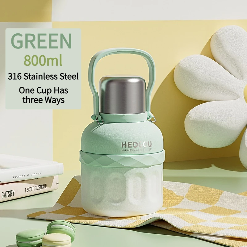Botella térmica de acero inoxidable (verde, 800 ml) con asa, apta para uso en exteriores.