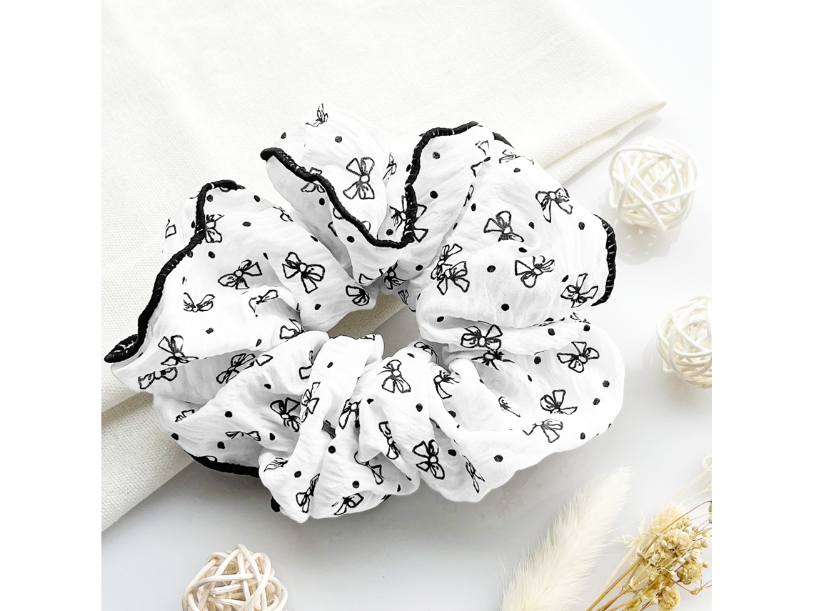 Crepe Estampado de Pelo Cuchu con Nudo de Mariposa en Blanco y Negro - NOTIFY