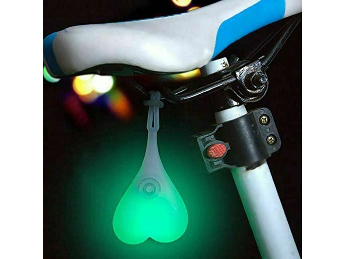Lámpara de seguridad para ciclismo con diseño impermeable, luz trasera LED para mochilas y bicicletas con 3 modos ajustables.