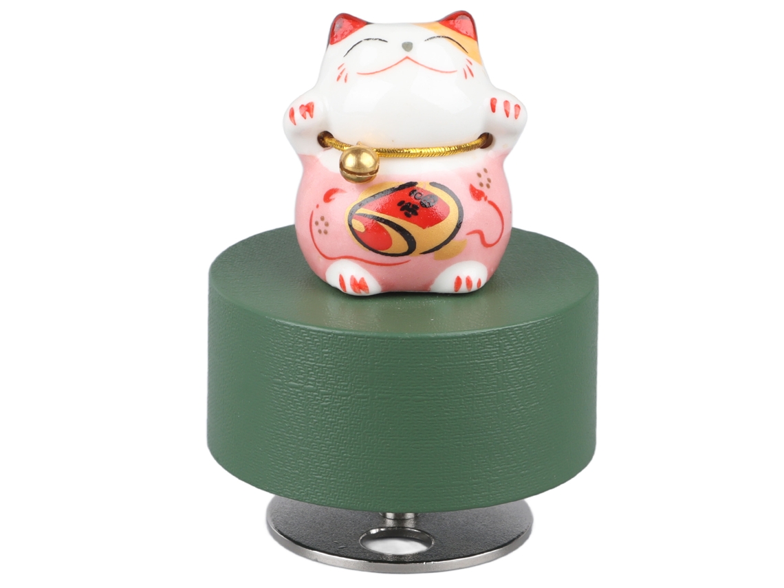 Caja musical redonda rosa con forma de gato de la suerte y una melodía agradable.