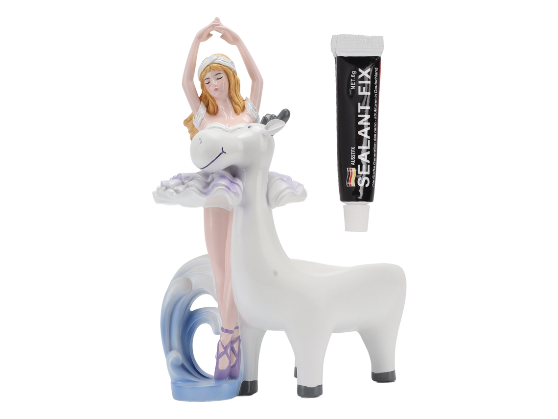 Plato Decorativo De Resina Con La Figura De Una Bailarina Para Guardar Pendientes Y Joyas Sobre Una Mesa.