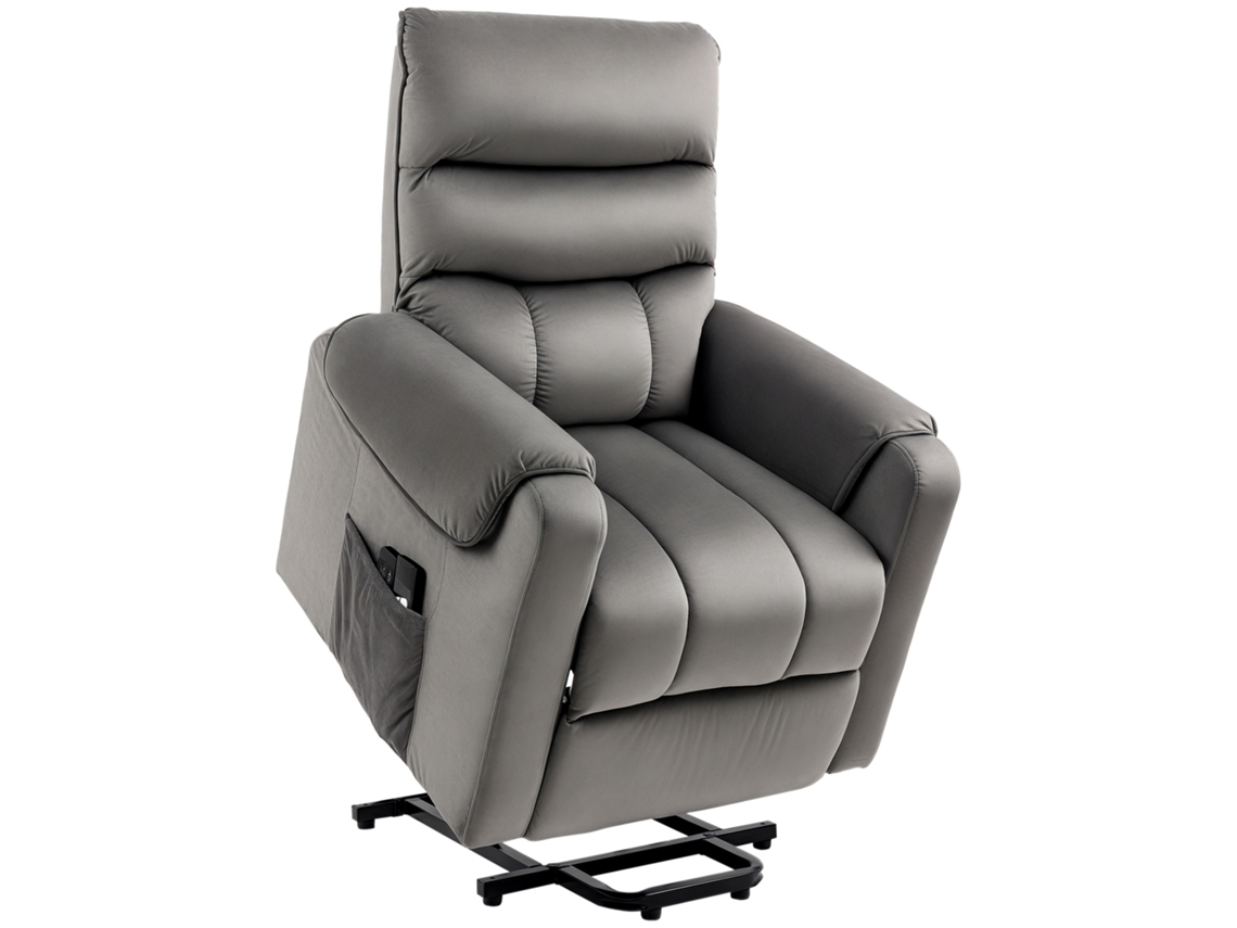 Sillón reclinable eléctrico con reposapiés acolchado y mando a distancia en tejido gris con aspecto de terciopelo.