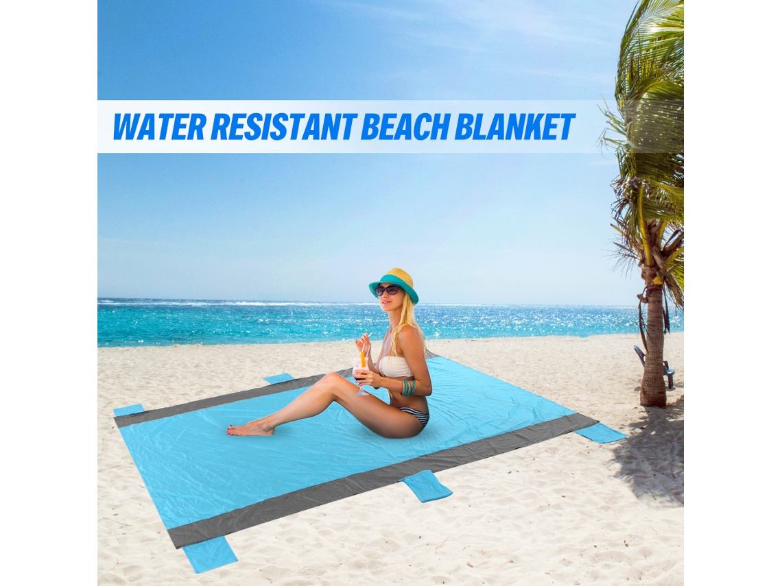 Manta de playa impermeable y resistente a la arena con estacas.