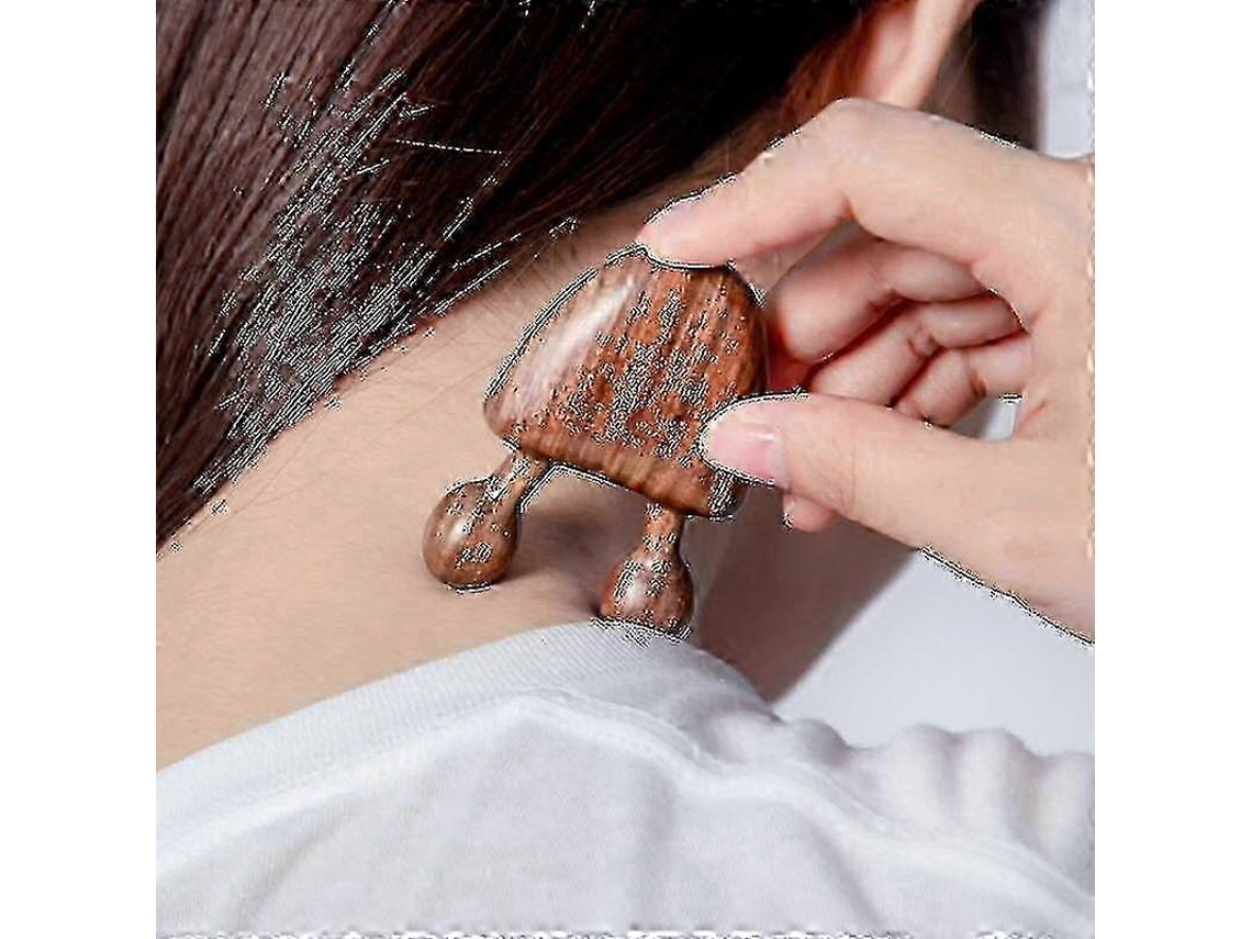 Herramienta de masaje facial de sándalo para la relajación ocular.
