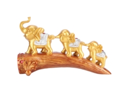 Estatua de elefante dorado en resina sintética para uso sobre mesa.
