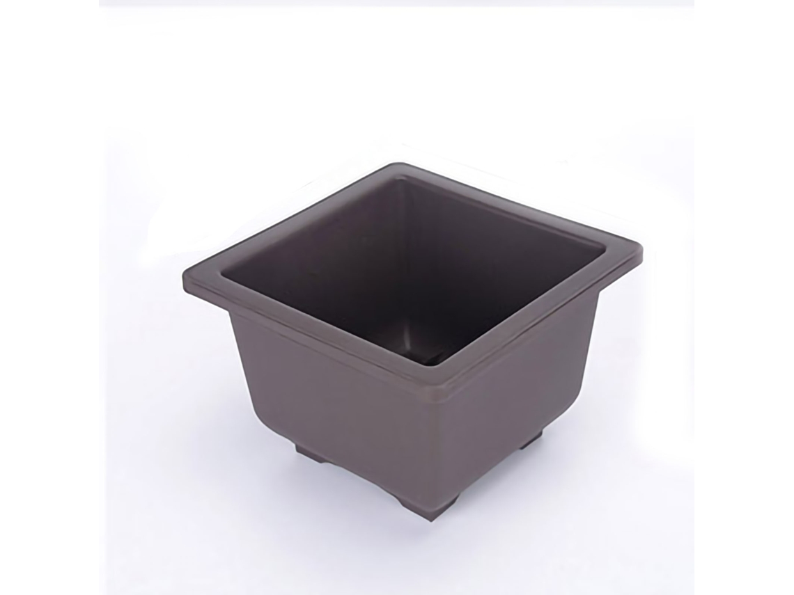 Maceta rectangular para suculentas con diseño de drenaje y bandeja.