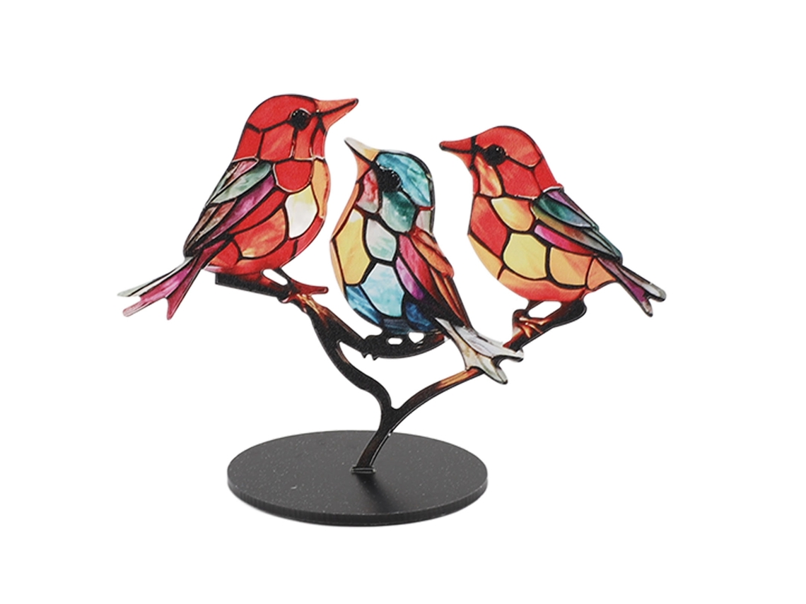 Adornos de pájaros en las ramas para la decoración del hogar