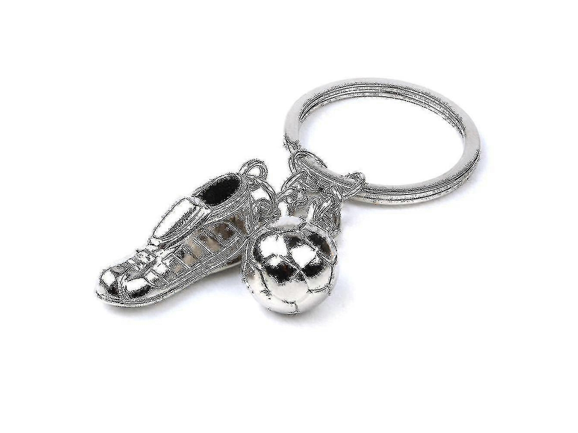 Llavero de metal creativo con colgante, estilo botín de fútbol, plateado.