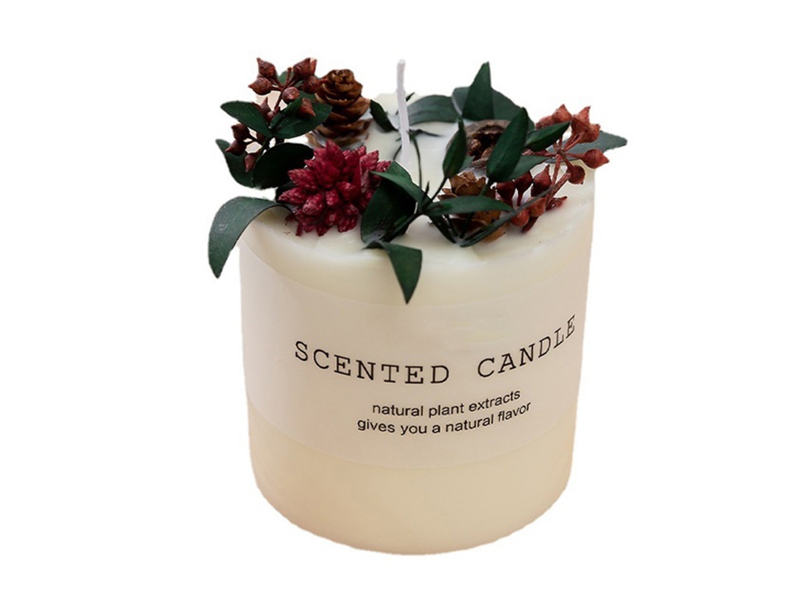 Vela perfumada de cera de soja con flores secas y adorno de cristal.