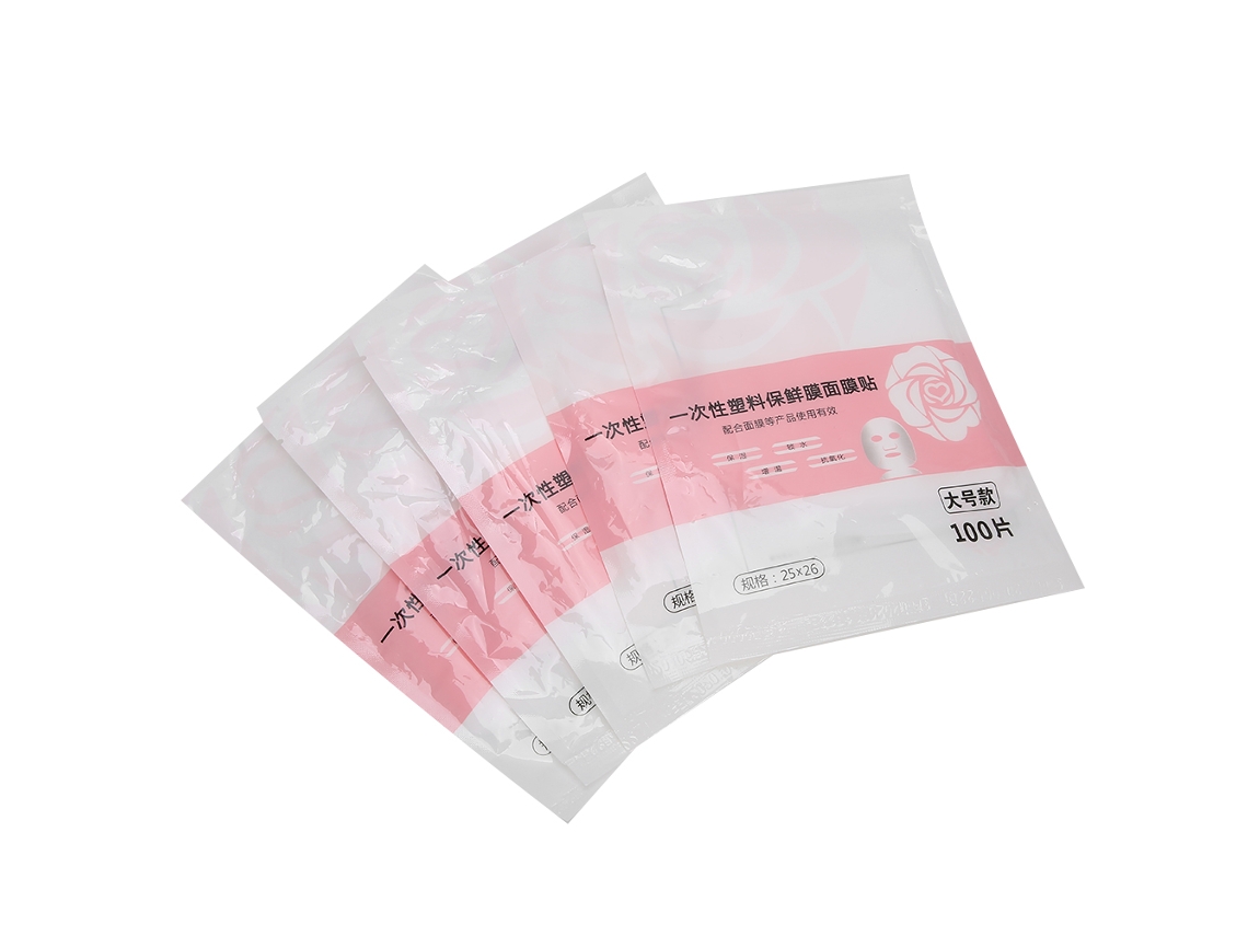 Mascarilla facial desechable de plástico transparente, lámina de papel hidratante, herramientas para el cuidado de la piel.